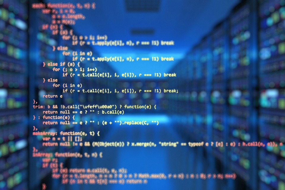 A computer screen displaying code in a data center, symbolizing custom software development.